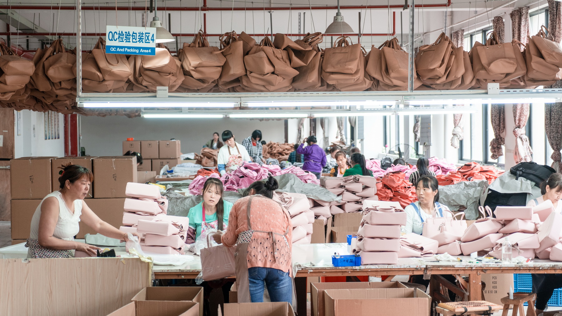 Workers packing finished bags in the factory