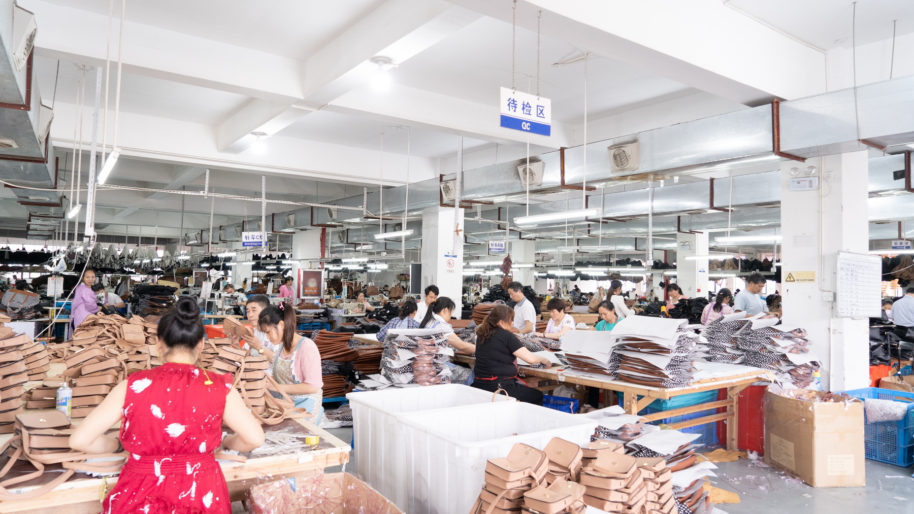 Factory workers checking and preparing finished products