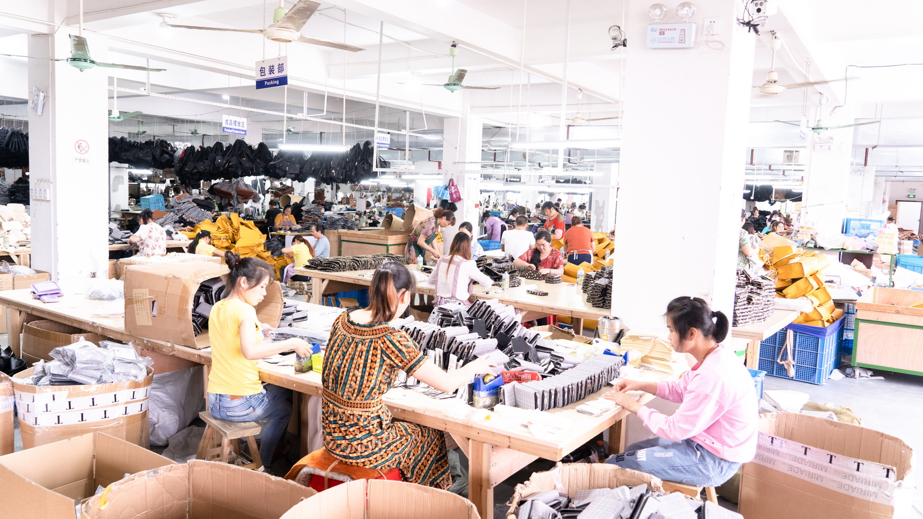 Workers packing products in the factory