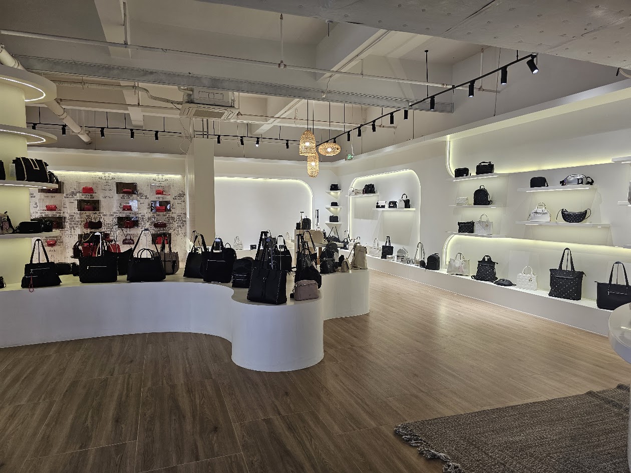 Handbags presented on showroom shelves